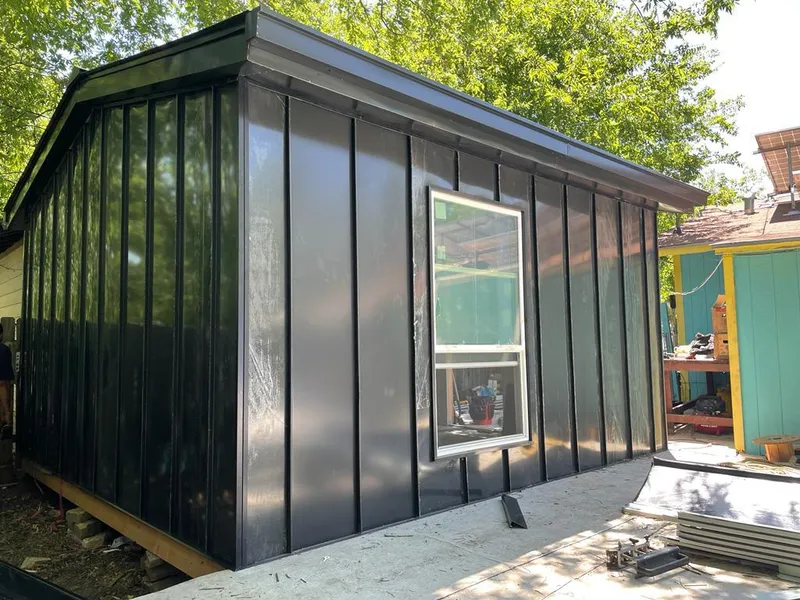 Black standing seam metal wall panels for Roof Inspection in Grants